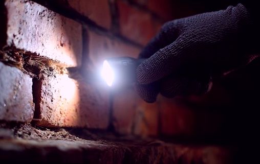Lamp held to a mortar gap while tracing water